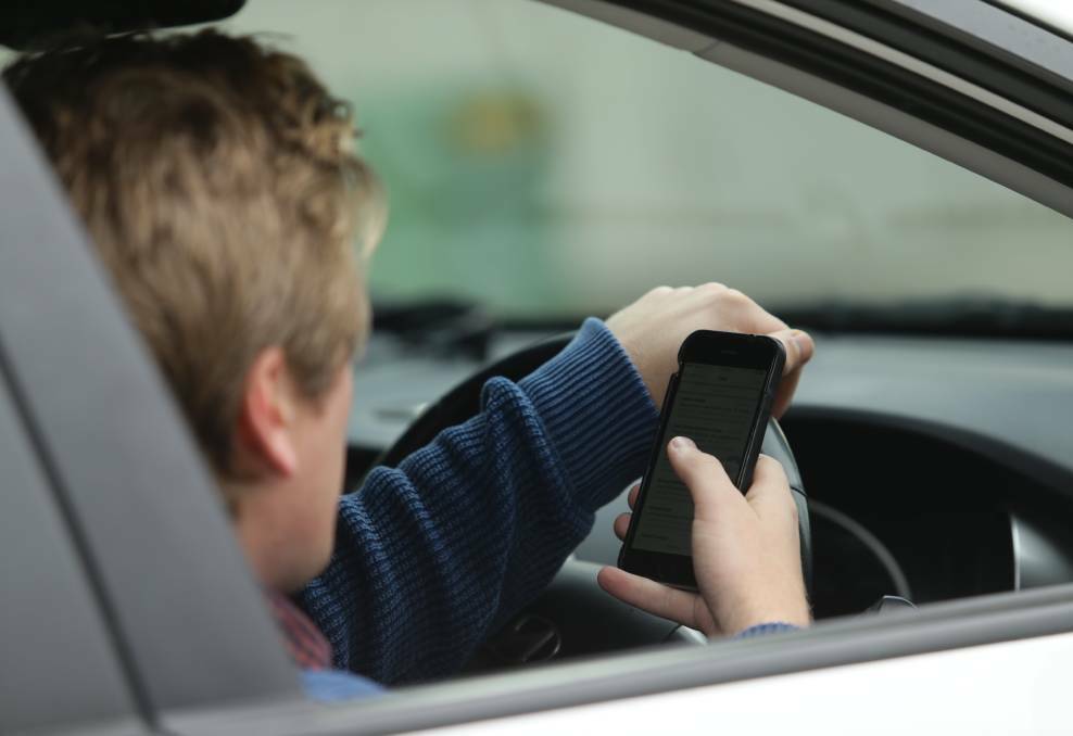 BIG MISTAKE: Police are targetting drivers using their phones.