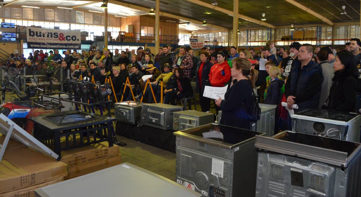 PACKED IN: Sunday's auction at Burns Auctions Barrett Court headquarters attracted a bumper crowd of bidders. Photo: DANIELLE CETINSKI
