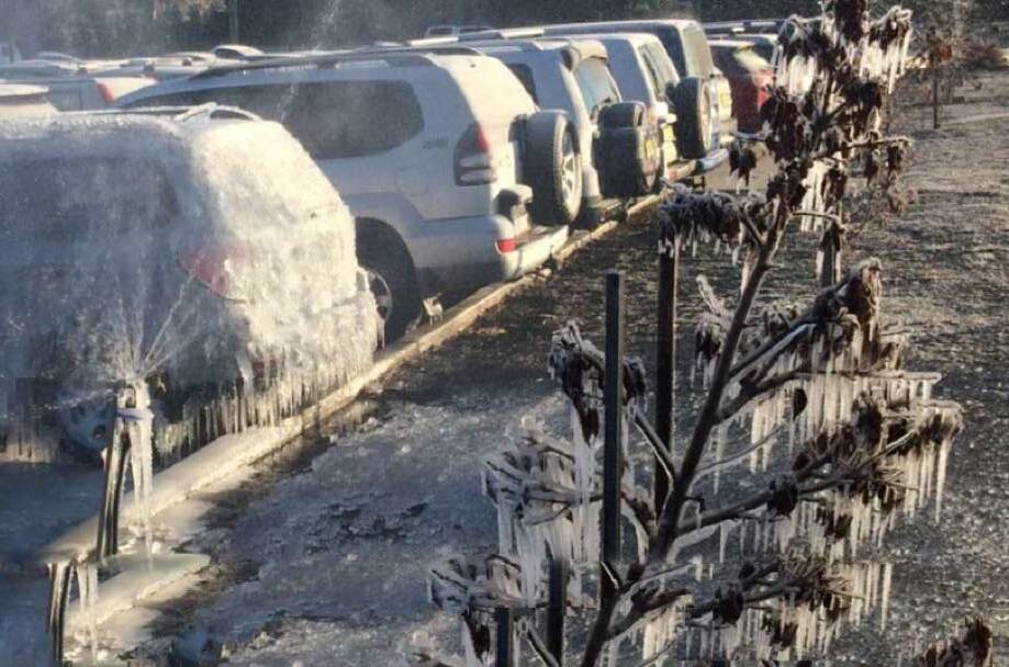ANYONE GOT A CHISEL HANDY: Parking near a sprinkler in the thick of winter is a mistake. Photo: DAN LAMB