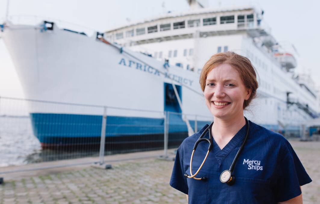 ON BOARD TO HELP: Doctor Sarah Lynar on shore, with the Afirca Mercy docked behind. Photo: CONTRIBUTED