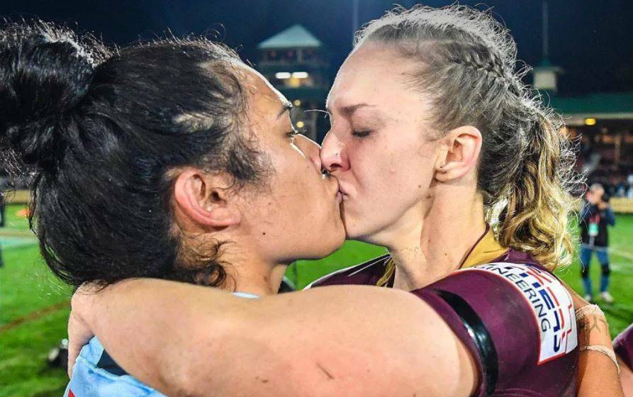 EMBRACE: Vanessa Foliaki (left) and Karina Brown kiss at the end of the inaugural women's State of Origin match. Photo: NRL/FACEBOOK