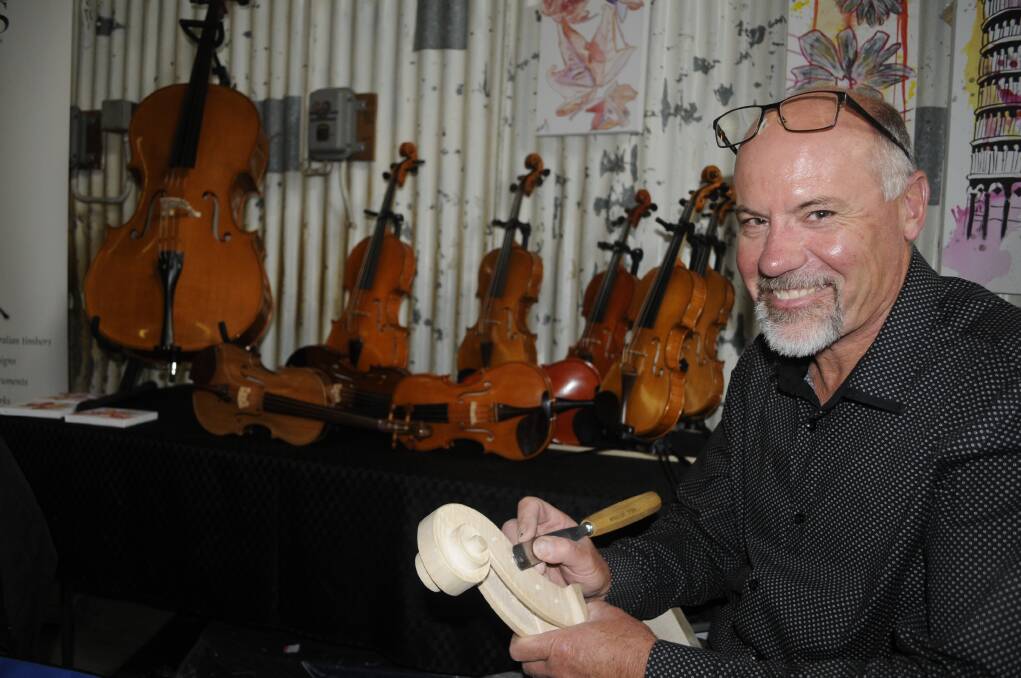 HANDCRAFTED: Peter Reid showcases the skills required to create a traditional violin at Bathurst's Artisan Trades Trail. Photo: CHRIS SEABROOK