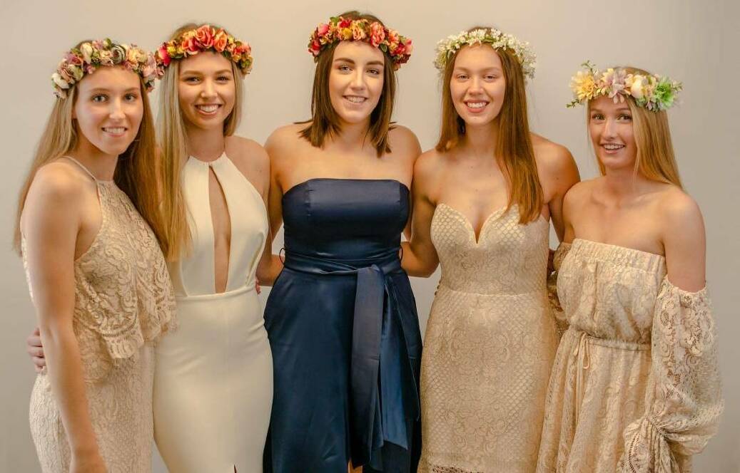 GRAD READY: Zali Nagle, Tara Nagle, Caitie Harvey, Maddie Cole and Lucy Brisbane model some of the outfits available for hire.