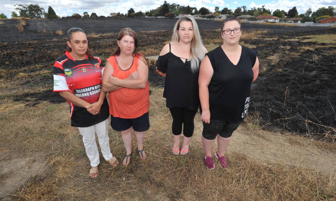 NOT HAPPY: Glenroi residents Lorrie Fuller, 
Melissa Hatton, Jessica White and 
Kelly McDonald at the site of Wednesday's
 fire. Photo: JUDE KEOGH.