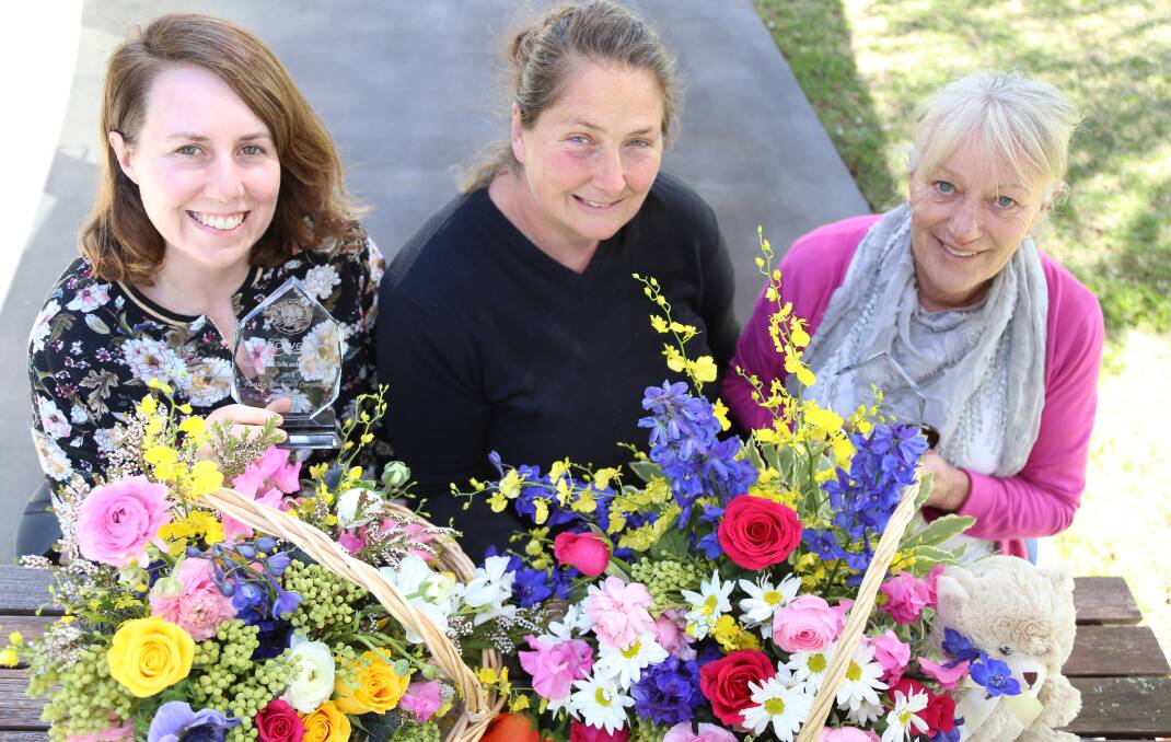 BLOSSOMING: Lindy Shallvey and Debbie Davidson with teacher Sarah Cox after winning Flower Growers Group of NSW scholarships.
