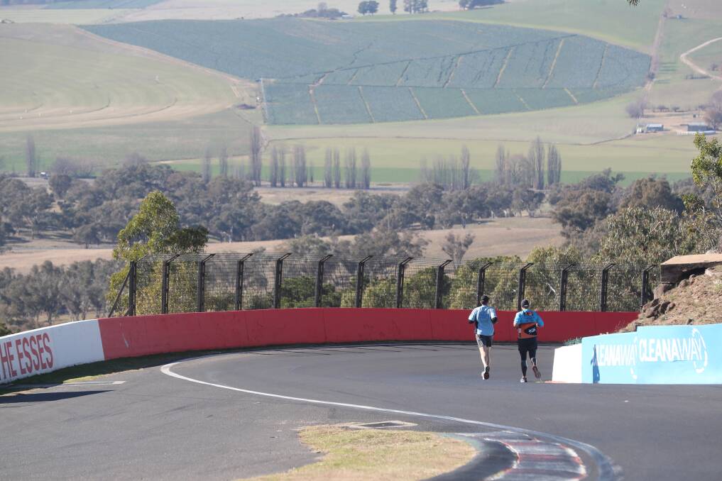 ON THE WAY DOWN: Phil Mounce-Stephens and a support runner make their way down The Esses on thew weekend.