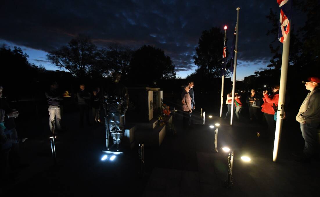 SOMBRE SCENE: Thursday morning's Dawn Service at Robertson Park. Photo: CARLA FREEDMAN