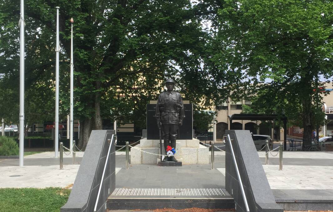 HE WILL REMEMBER: Reg Golding OAM's poppies at the Orange Cenotaph on Monday morning.