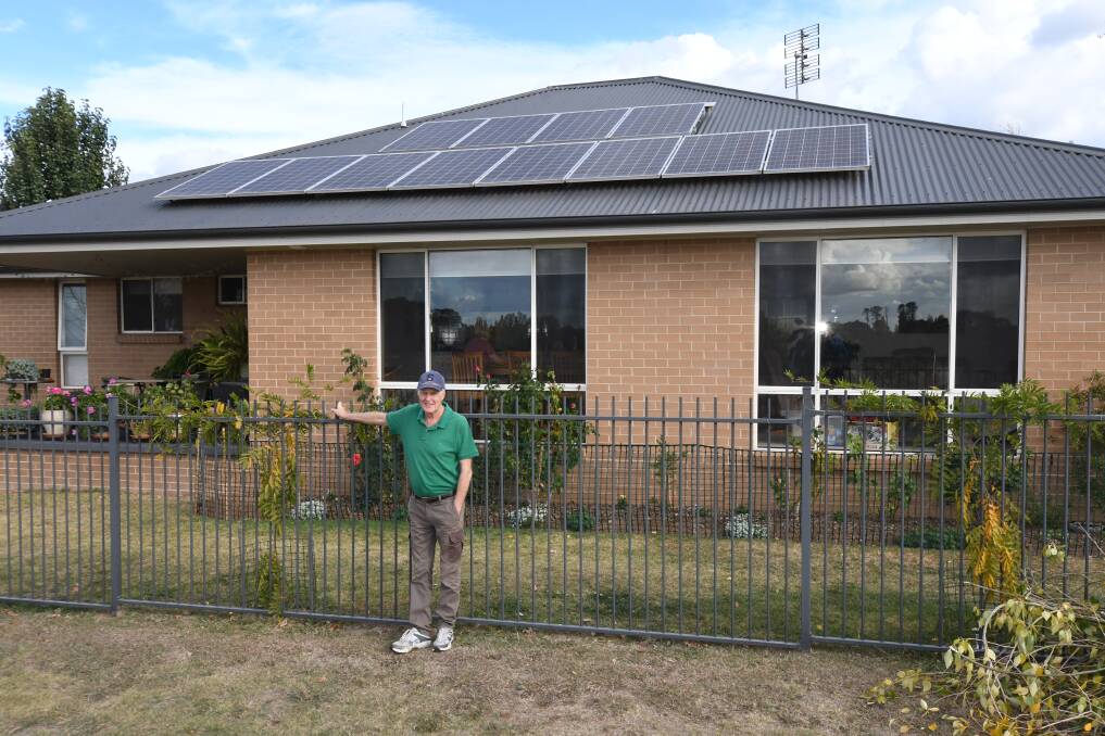 ALREADY ON BOARD: Environmentally Concerned Citizens of Orange member Neil Jones outside his solar panel-clad house. Photo: CARLA FREEDMAN 0422cfsolar1
