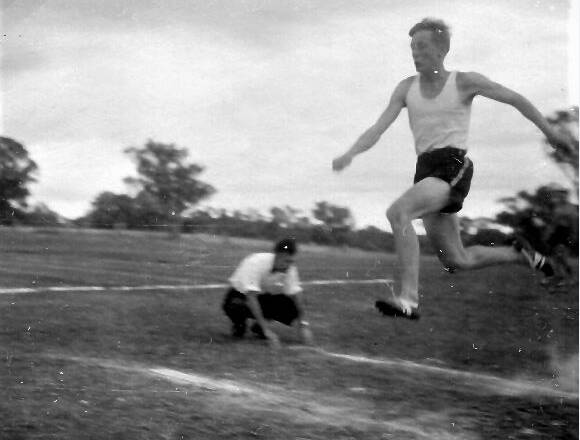 TIME TO TAKE OFF: Ron Sinclair attempting the triple jump during an 'Olympics' event at Fairbridge Farm. Photo: SUPPLIED