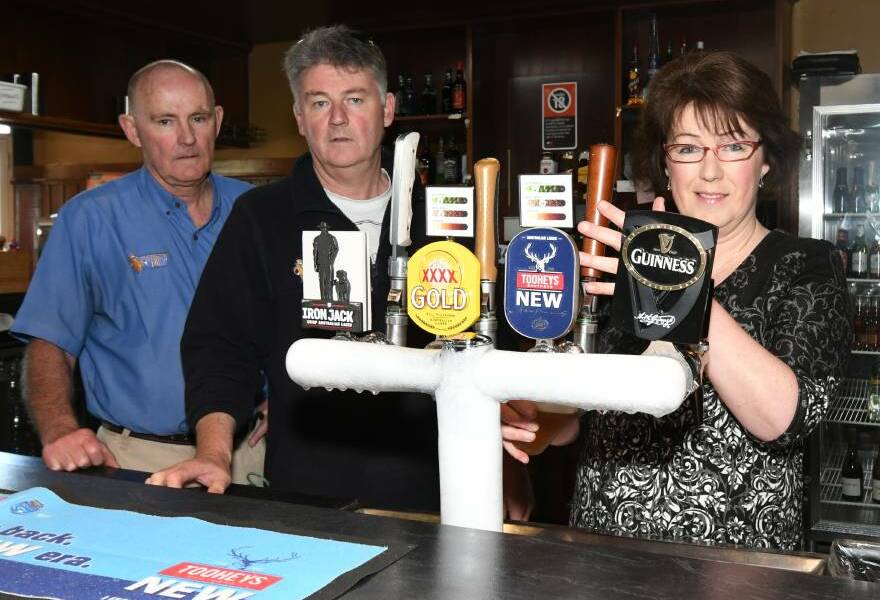 FAREWELL: Siblings Bill and Mark Kelly and Melissa Englert at Kelly's Rugby Hotel as the pub started its last week of trading after 96 years. Photo: CARLA FREEDMAN