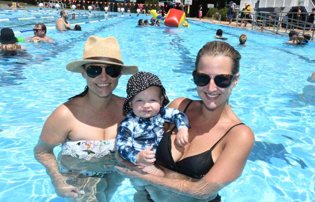 TIME TO COOL OFF: Sophie Allerton with Barnaby and Emily Mann in the cooling waters of the outdoor pool at Orange Aquatic Centre. Photo: CARLA FREEDMAN