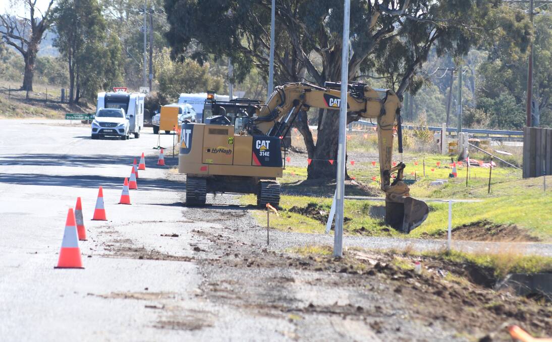 DIGGING IN: Crews starting their months of work on Burrendong Way on Tuesday morning. Photo: JUDE KEOGH