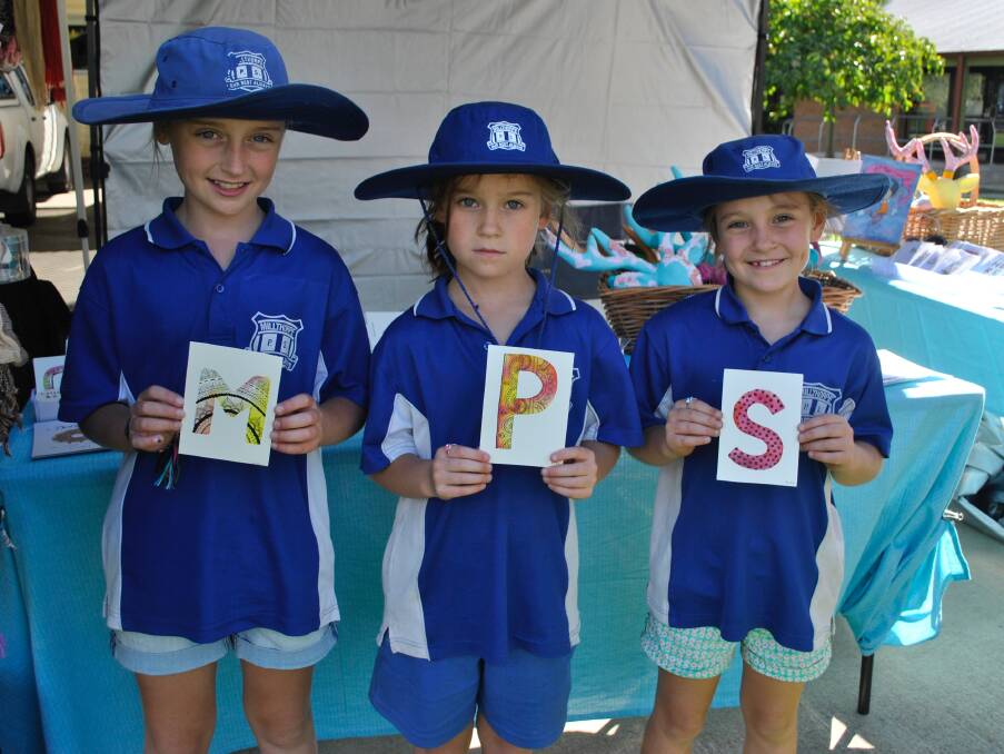 SPELLING IT OUT: Millthorpe Public School students Jamilla, India and Penny Worland are ready to play their part in the school's 150th anniversary celebrations on Friday. Photo: MILLTHORPE IN PICTURES AND WORDS, published by Orange Press.