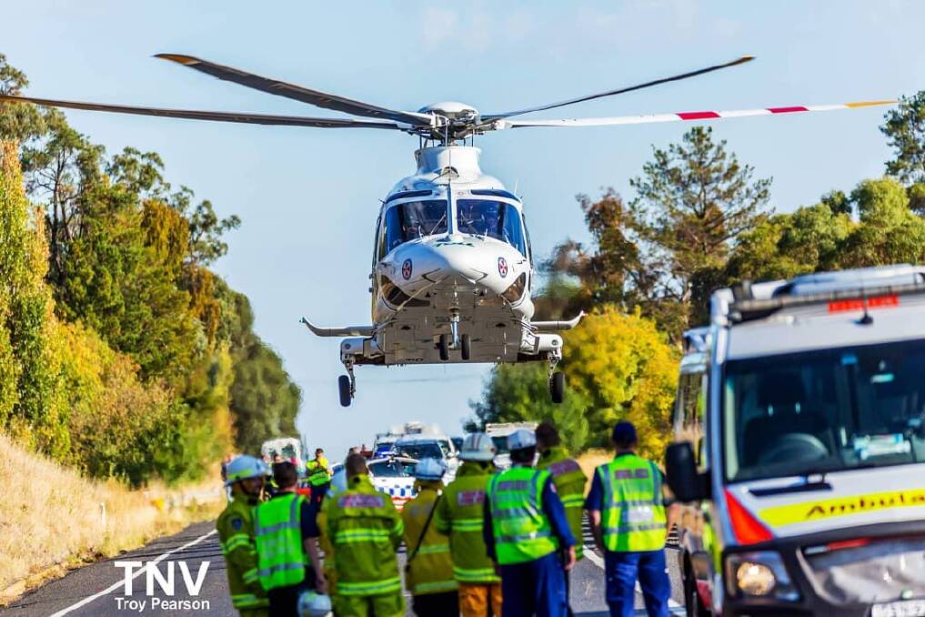 INJURED: A teenager is in a serious condition after Saturday morning's crash on the Mitchell Highway. Photo: TROY PEARSON/TOP NOTCH VIDEO