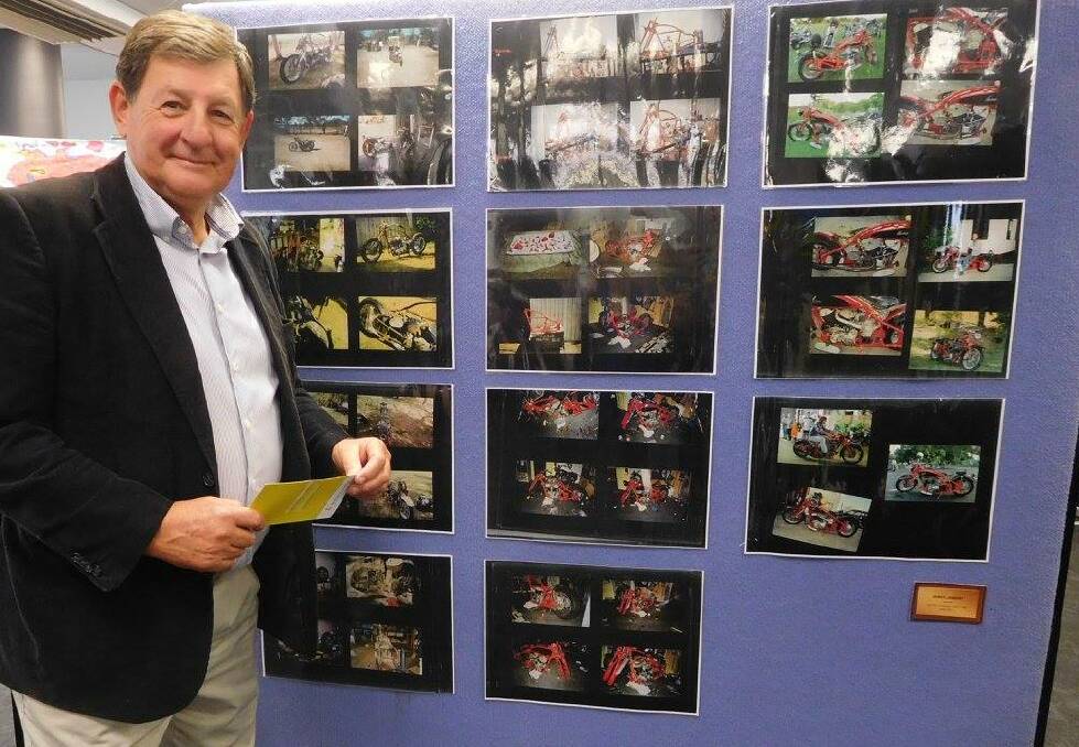 Orange mayor Reg Kidd, who opened the 'Celebration' exhibition, pictured with artwork by James Lambert titled 'Photos of Indian Chout that James Built'. Photos: FACEBOOK