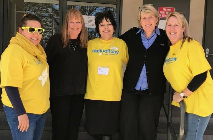 ALWAYS GIVING: Sandy Ostini (centre) ready to go on yet another Daffodil Day campaign.
