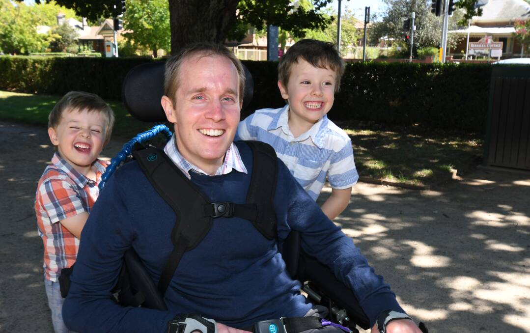 GETTING AROUND: Tim, Dr Steve and Luke Peterson enjoying the summer sun in Cook Park on Sunday. Photo: CARLA FREEDMAN 0217cfpeterson6