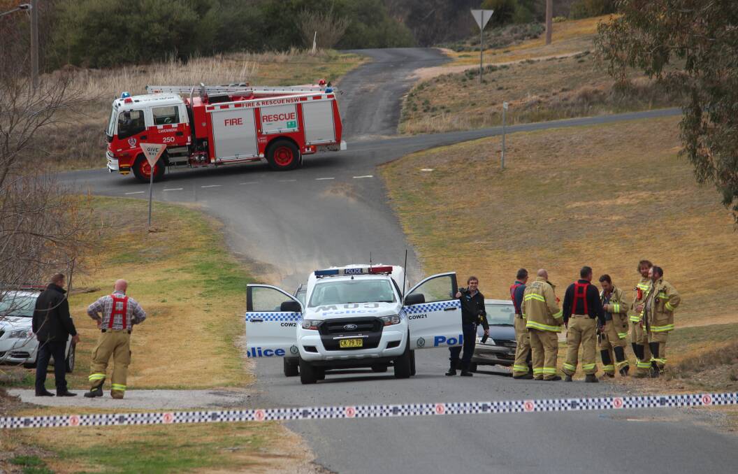 THE SCENE: Police and other emergency services crews in Canowindra on Friday.