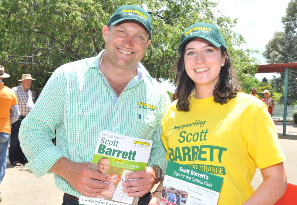 STILL TRAILING: Nationals candidate for the seat of Orange Scott Barrett and supporter Phillipa Noakes on Saturday. Photo: JUDE KEOGH
