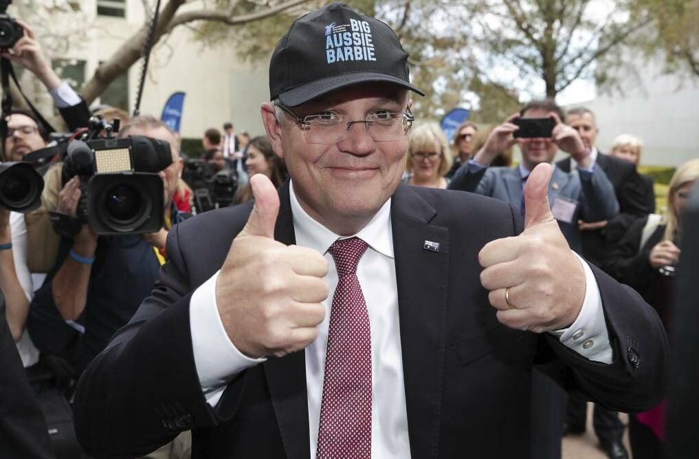 OH CAP-TAIN, OUR CAP-TAIN: Another day, another cap for Prime Minister Scott Morrison. Photo: ALEX ELLINGHAUSEN