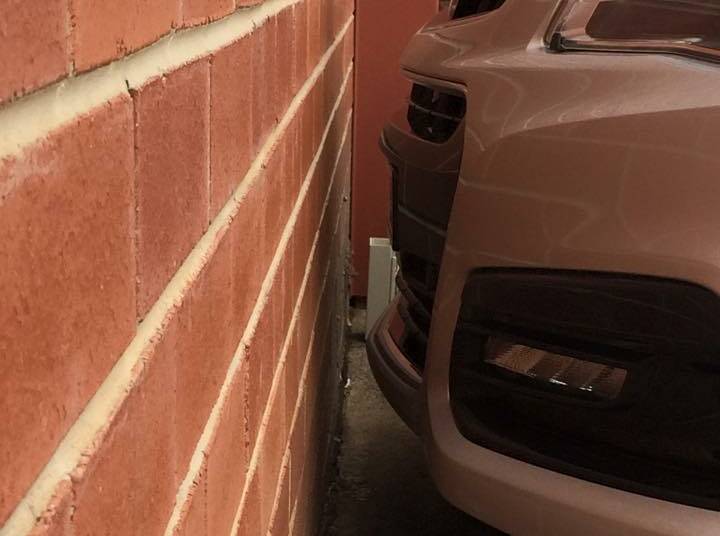 SO CLOSE: Nose-in parking is a difficult task at the best of times ... for some of us, anyway. Photo: CONTRIBUTED