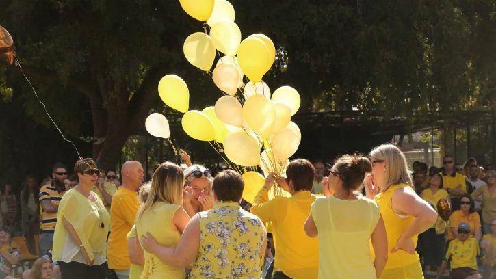 TRIBUTE: Friends and family paying tribute to murdered teacher Stephanie Scott not long after her death.