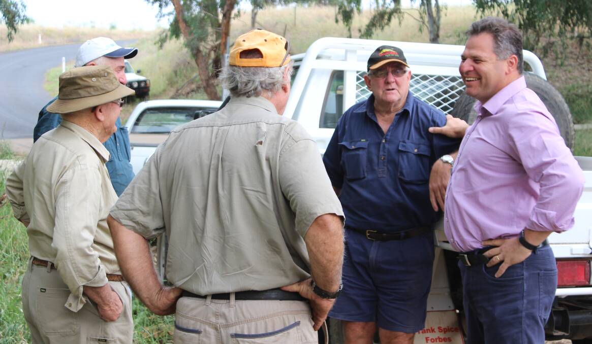 GATHERING: Member for Orange Phil Donato with Back Yamma farmers and Landcare coordinator Marg Applebee to discuss disaster relief funding. Photo: CONTRIBUTED
