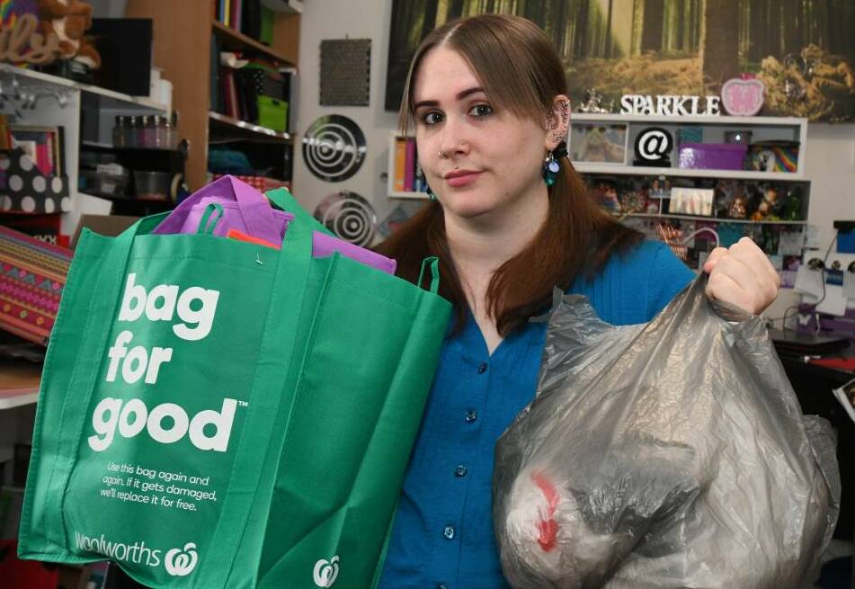  UNHAPPY CUSTOMER: Chloe Berryman wanted to reuse a thin plastic bag for her groceries, but was asked to buy one. Photo: JUDE KEOGH 0809jkbags2