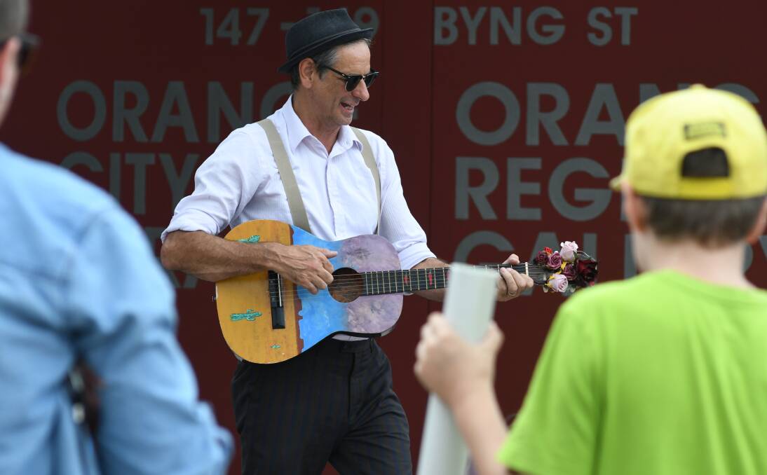 ON SONG: Kenneth Smith entertaining the crowd near the library during JAM Saturday’s Live and Local event. Photo: JUDE KEOGH