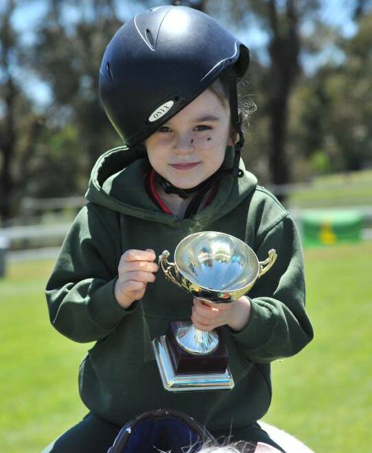 WINNER, WINNER: Cheyanne Rondo during the 2016 edition of Riding for the Disabled  Orange's Melbourne Cup Day event. Photo: JUDE KEOGH