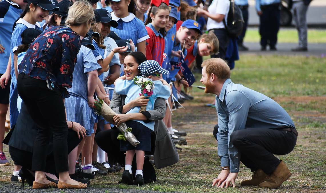 WARM RECEPTION: Luke Vincent, a student at Buninyong Primary School, was among those invited from public schools to welcome the Duke and Duchess of Sussex at the Dubbo airport.