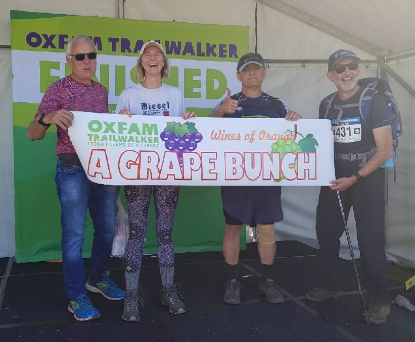 JOB DONE: Philip Shaw, Debbie Lauritz, Justin Jarrett and Justin Byrne show their pride and relief at completing the Oxfam Trailwalker course. Photo: CONTRIBUTED