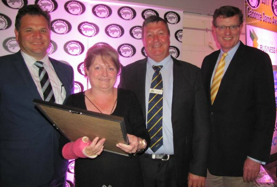 DEFENDING CHAMPION: Debbie Gant, the manager of SPAR Supermarket Molong, with member for Orange Philip Donato, Cabonne mayor Kevin Beatty and member for Calare Andrew Gee at last year's Daroo Business Awards.