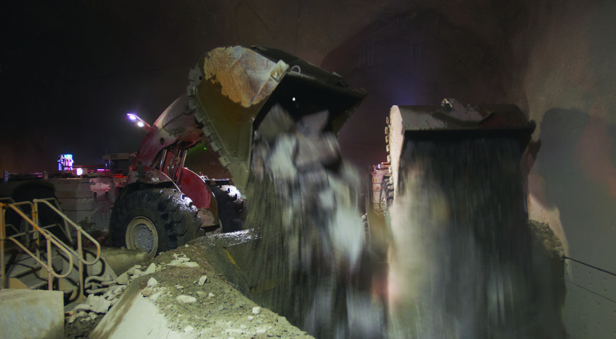HARD AT WORK: An underground loader tipping ore into the crusher at Cadia Valley Operations.