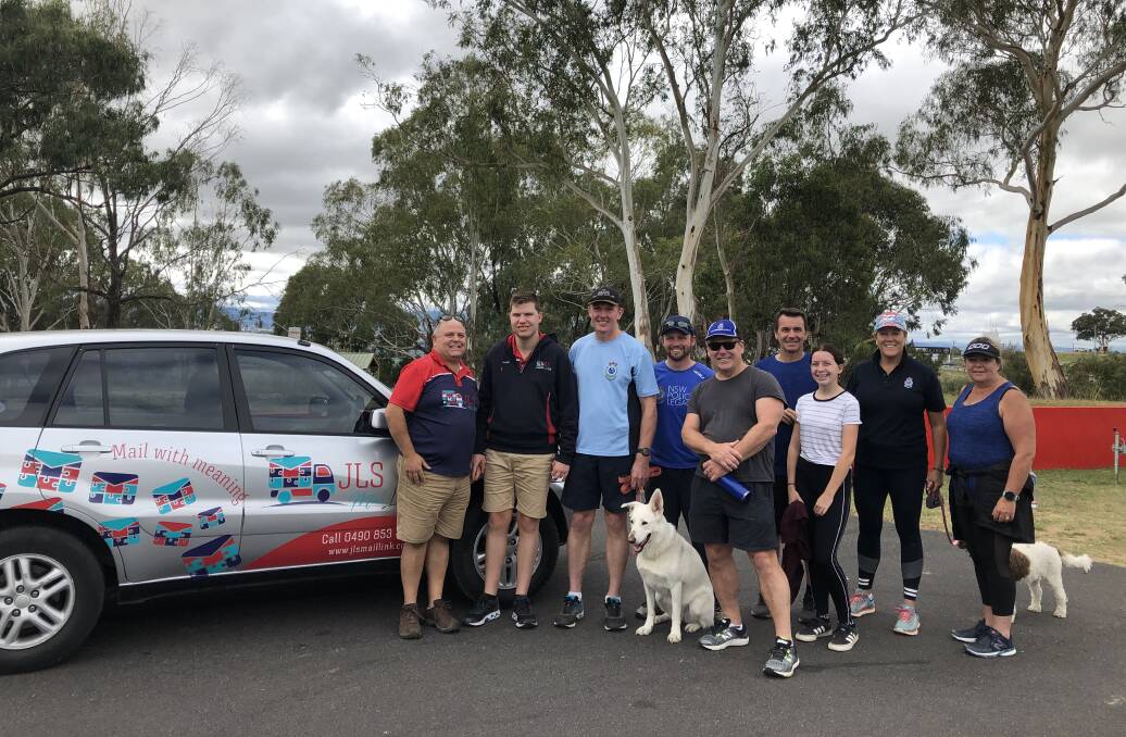 SUPPORT ALONG THE WAY: Former and current police officers, and friends supporting Phil Mounce-Stephens, at Mount Panorama.