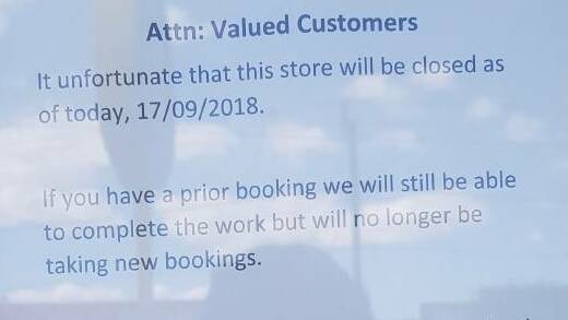 SAD NEWS INDEED: A note in the window of the Peisley Street store letting its customers know the situation.