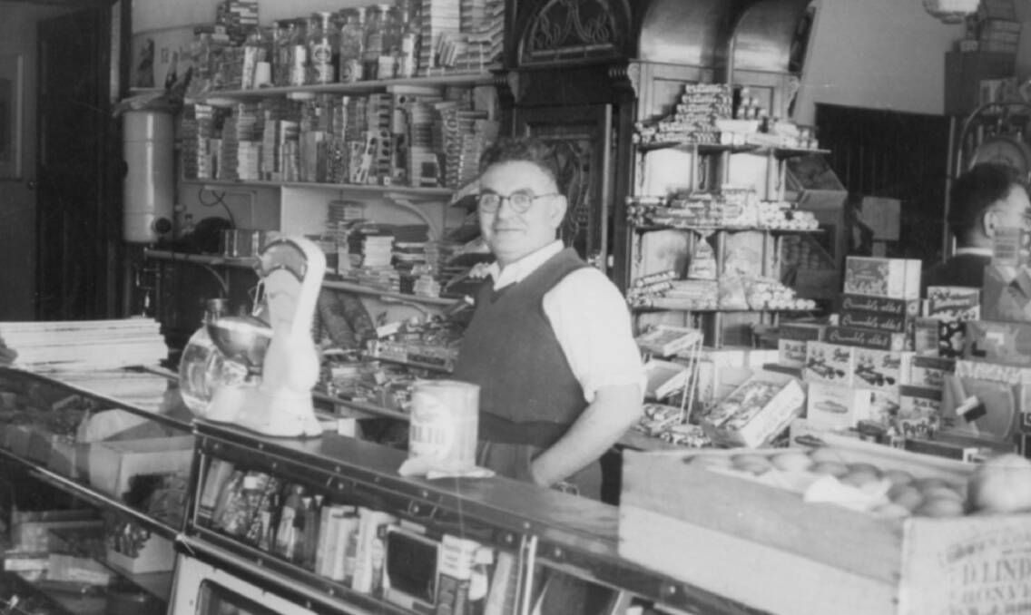 READY TO SERVE: Anthony Kaloutsis behind the counter of his shop in the late 1950s or early 1960s. 118 Summer Street will soon house another business after being closed as a shop front for almost 50 years. Photo: CONTRIBUTED