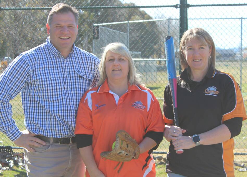 HOME RUN: Orange and District Softball Association’s secretary Lisa Tracey and minute secretary Pam Kelly with member for Orange Philip Donato. Photo: FACEBOOK