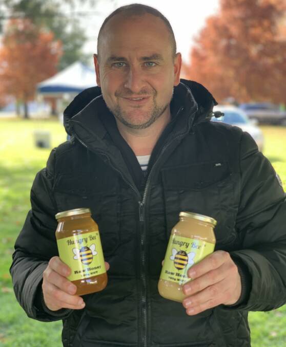 SWEET OFFERING: Chris Anderson with some Hungry Bee's honey. Photo: SUPPLIED