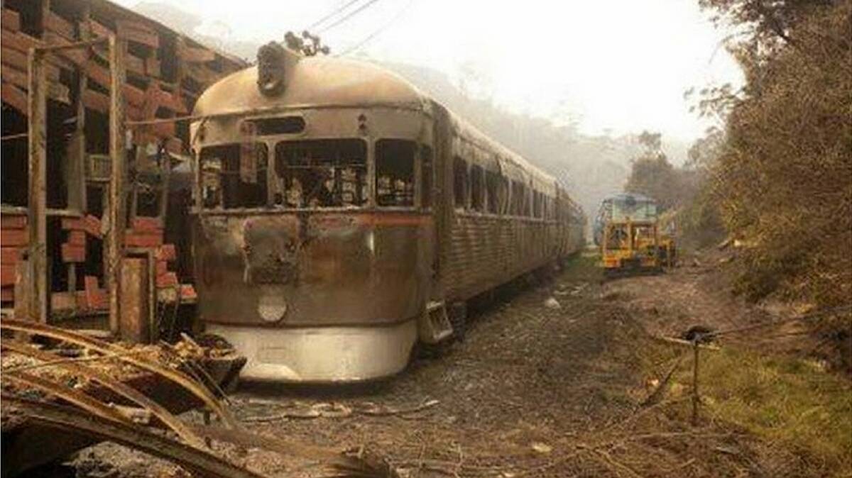 DEVASTATION: Burnt-out carriages at the Zig Zag Railway following a 2013 bushfire.