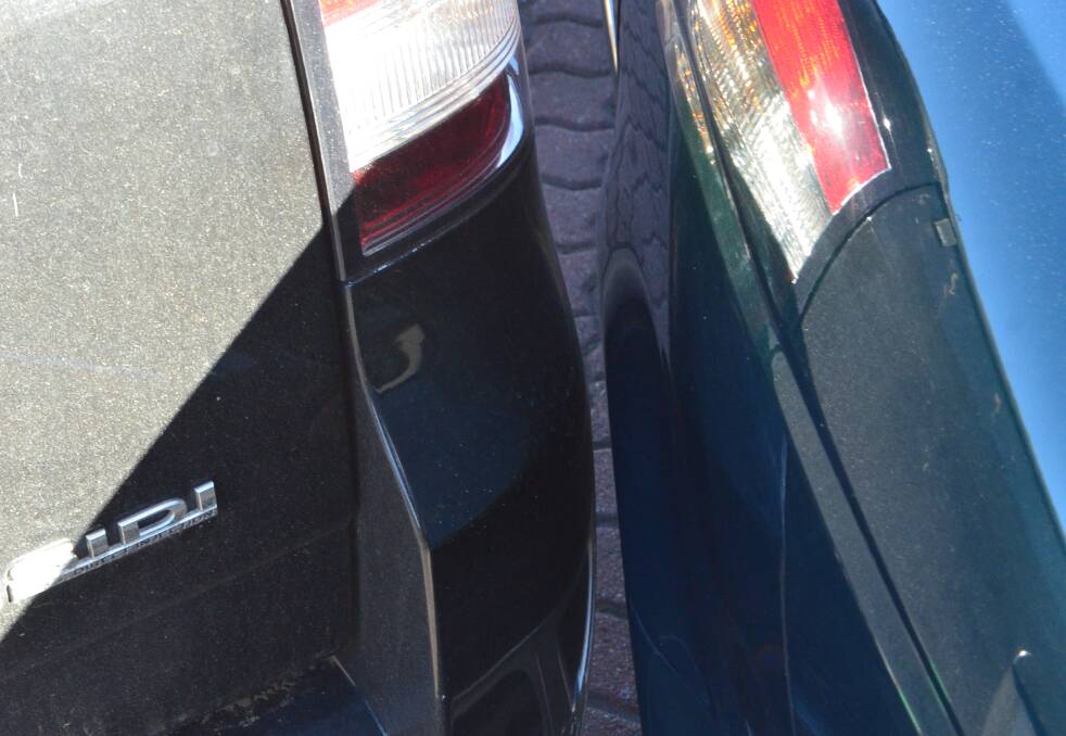 MATTER OF INCHES: The space between two parked cars on Saturday.