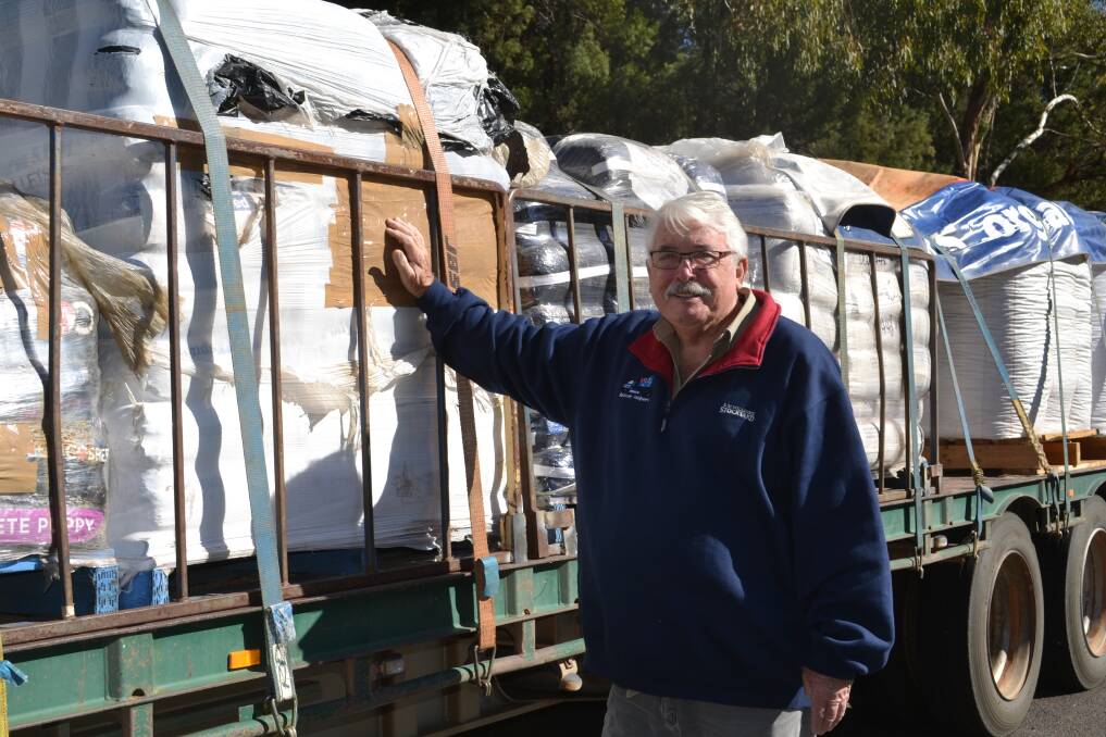 THERE FOR FARMERS: Aussie Helpers co-founder Brian Egan with one of the loads of stock feed brought in to help the region's primary producers. Photo: FAYE WHEELER