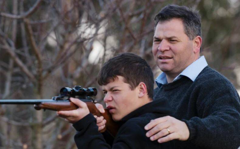 IN THEIR SIGHTS: Shooters, Fishers and Farmers Party member for Orange Phil Donato with 13-year-old son Sean on their property outside Orange. Photo: JAMES BRICKWOOD