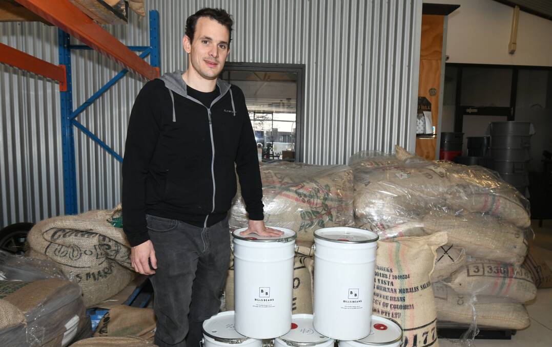 AT IT AGAIN: Orange Roasting Co's Michael Butchard among the reusable containers. Photo: CARLA FREEDMAN