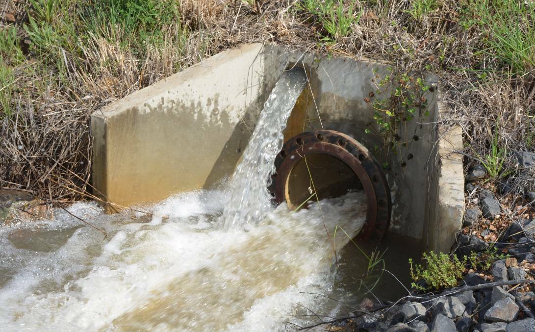 OUT IT COMES: Water comes through the pipe at Suma Park Dam during testing in December last year. Photos: SUPPLIED