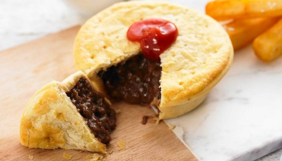 HOOKING IN: A meat pie with tomato sauce - an Aussie classic.
