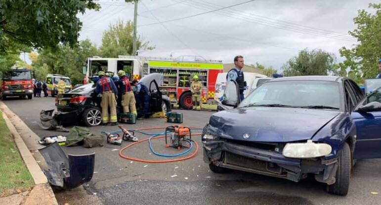 CRASH: A male driver of one car was trapped and taken to hospital and police are searching for the other driver who was involved in a car crash on Saturday. Photo: SUPPLIED