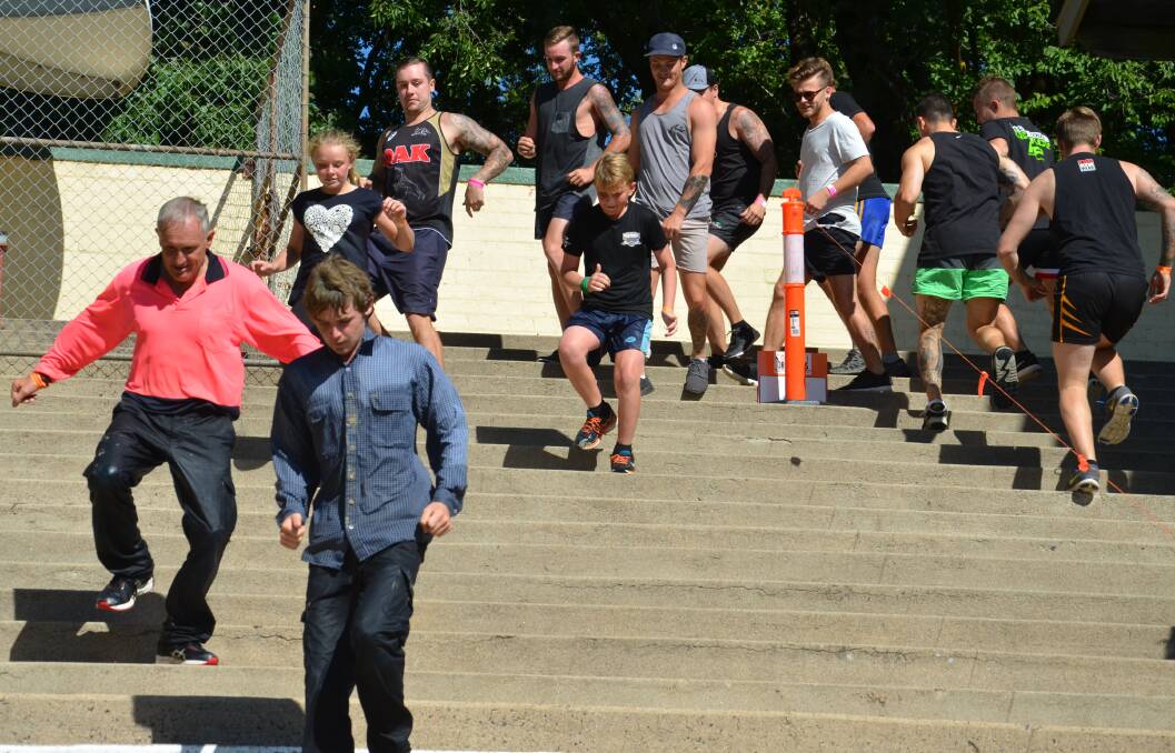 IN THEIR OWN GEAR: Runners
tackle the stairs at Towac Park
during the Outback Obstacle
event on Saturday, January 21.
Photo: DECLAN RURENGA