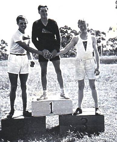 THREE OF THE BEST: Ronnie Wright, Laurie Reid and Derek Moriarty on the homemade dais for the Fairbridge Olympics in 1957. Photo: SUPPLIED